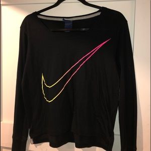 Black nike long sleeved shirt with neon Nike sign